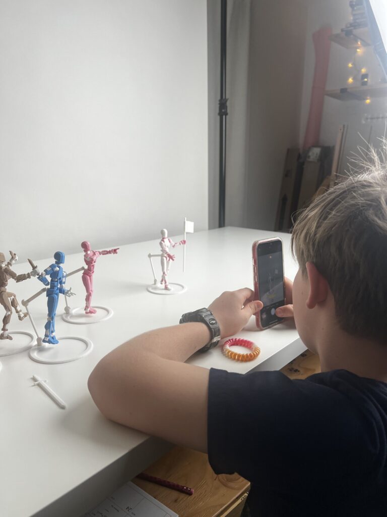 Zoom-in on Phoenix adjusting pose using a phone