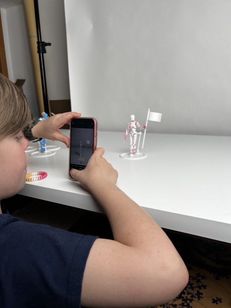 Phoenix taking photos of a posed figure