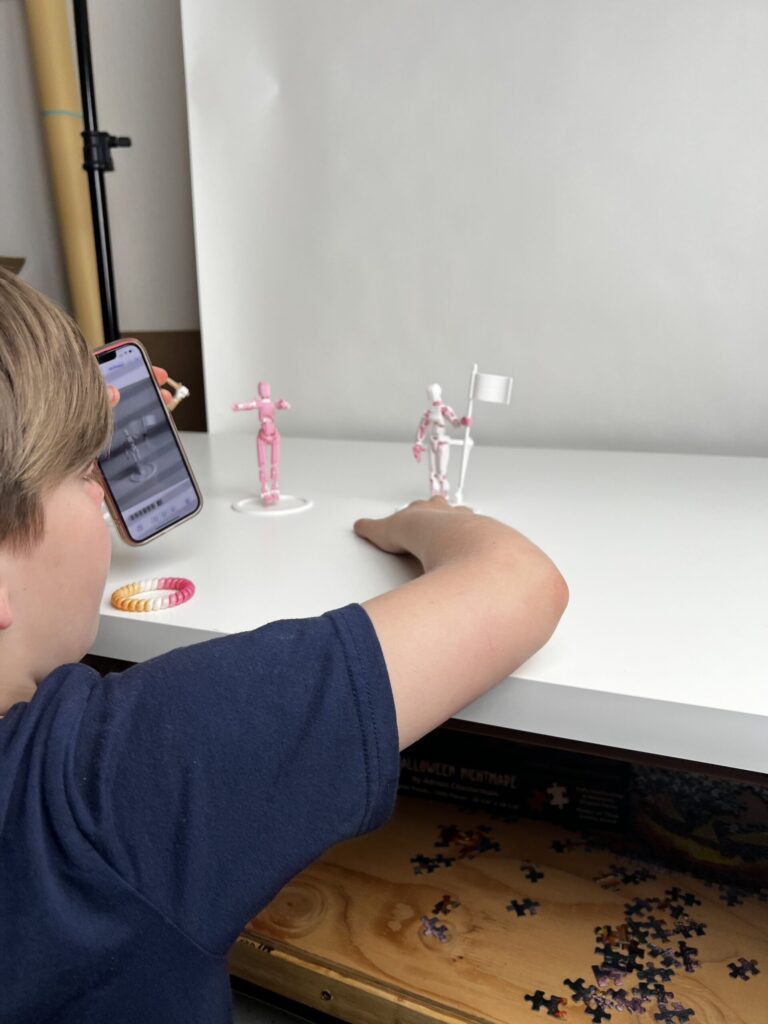Phoenix taking photos of a posed figure